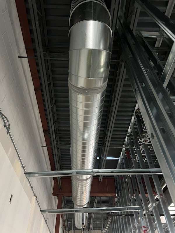 Custom sheet-metal ductwork fabricated and installed by American Mechanical Works
