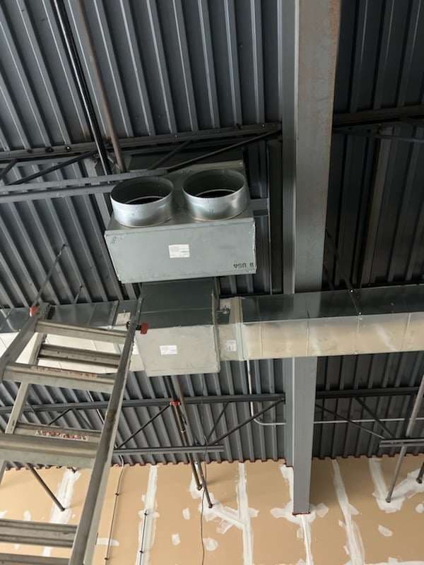 Custom sheet-metal ductwork fabricated and installed by American Mechanical Works