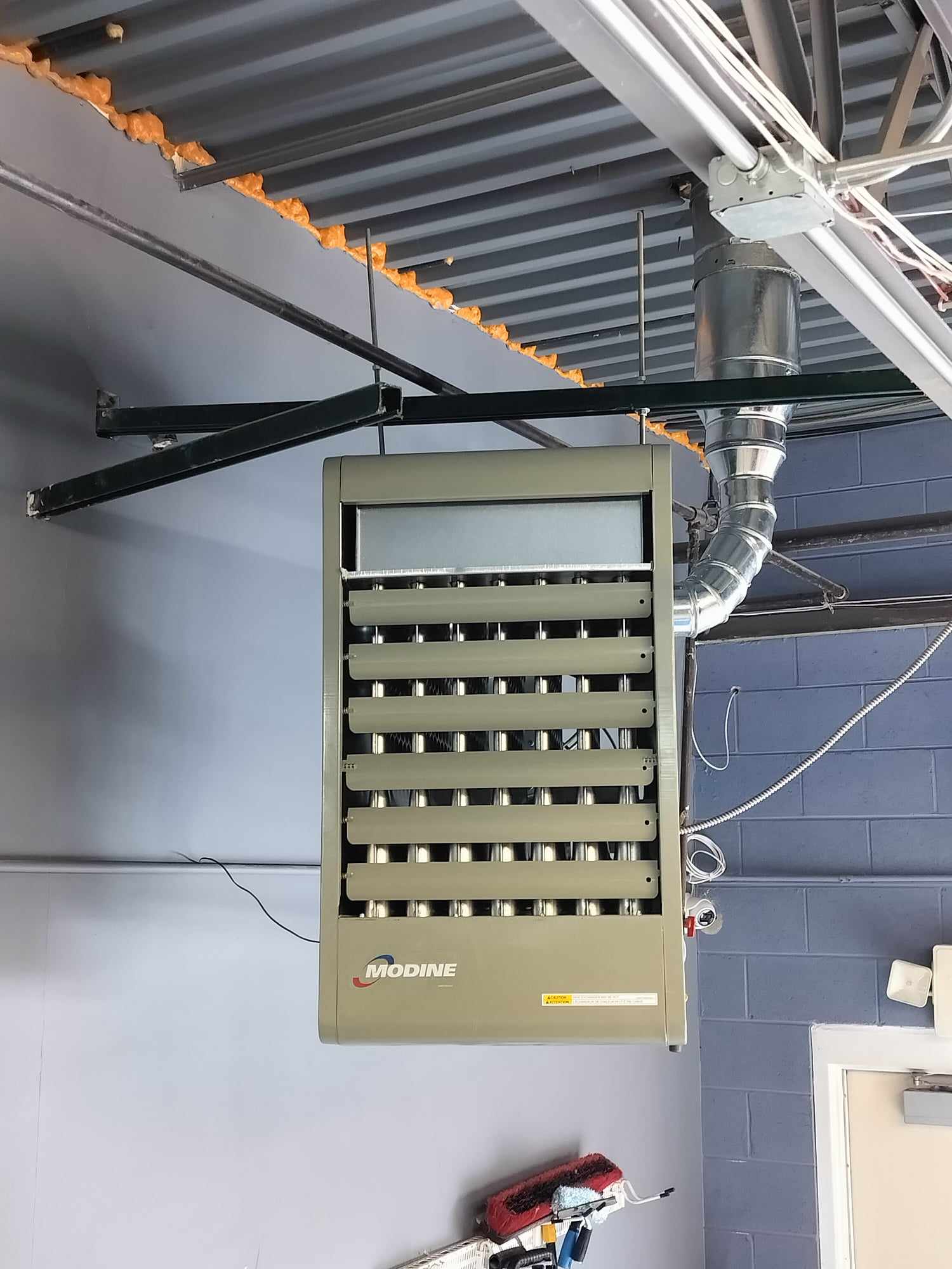 Gas-fired unit heater installed in a warehouse by American Mechanical Works